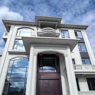 丹东白麻别墅外墙干挂石材效果示例