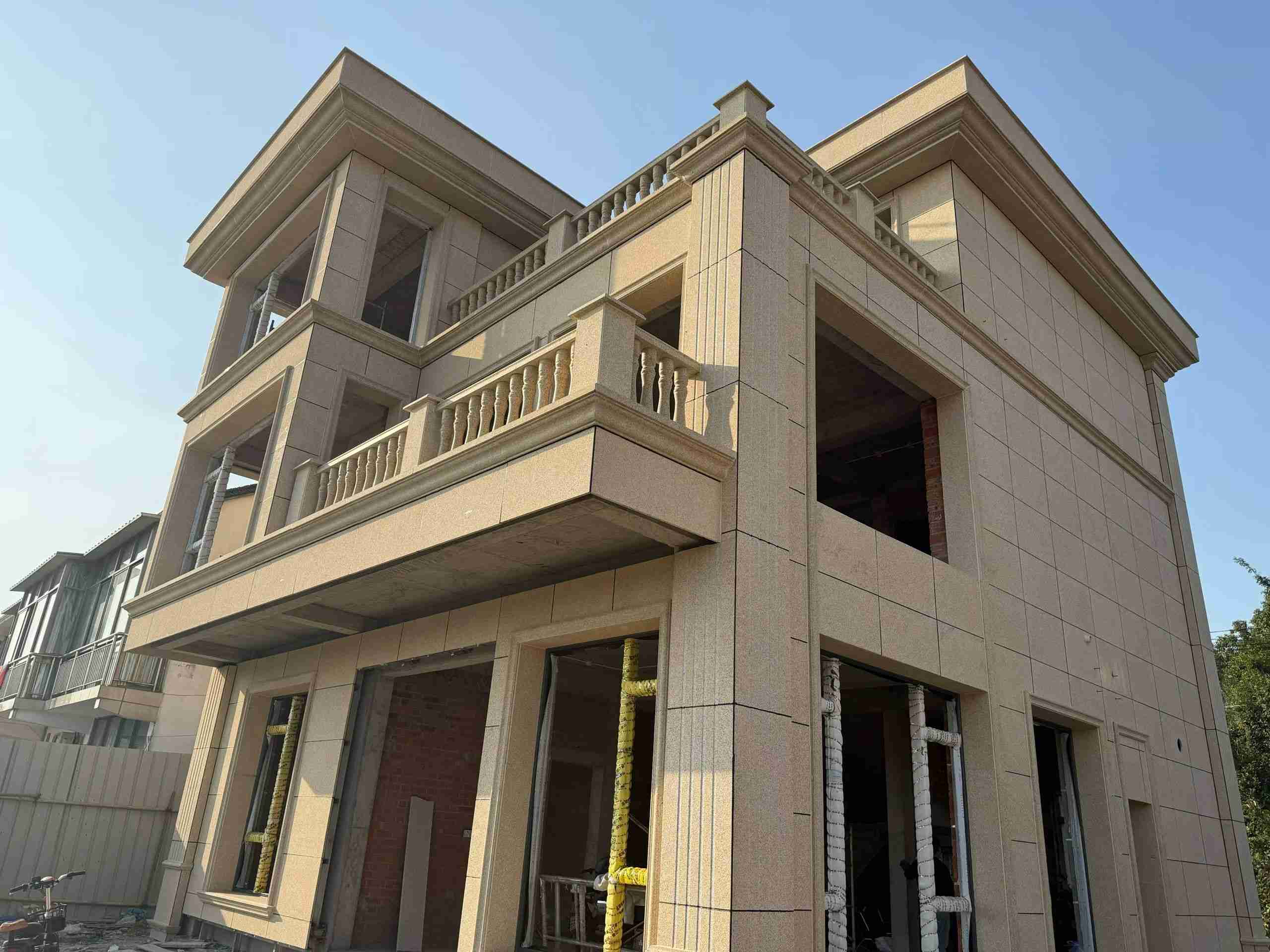 丹东 黄金麻花岗岩石材荔枝面外墙干挂效果展示